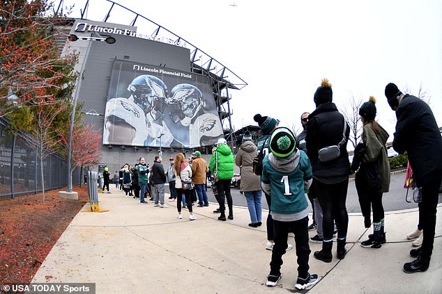 Eagles fans line up at Lincoln Financial Field on Sunday before the Philadelphia team plays the San Francisco 49ers.