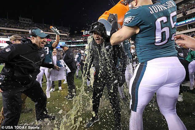 Philadelphia Eagles head coach Nick Sirianni has Gatorade thrown on him by Lane Johnson