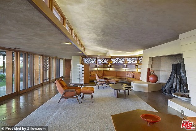 This is the living room of the house, complete with furniture reminiscent of a 1960s vibe.