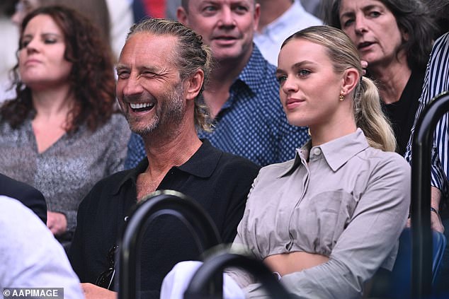 The 26-year-old joined her billionaire boyfriend Baron, 50, to watch Novak Djokovic's two-set victory over Stefanos Tsitsipas at Melbourne Park.