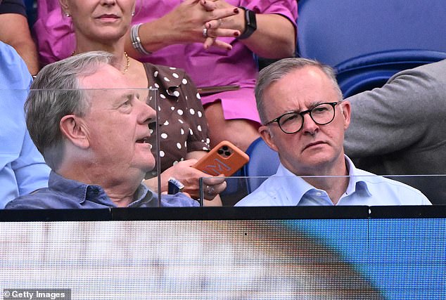 Costello and Albanese appear to be having a serious conversation during the Australian Open women's final