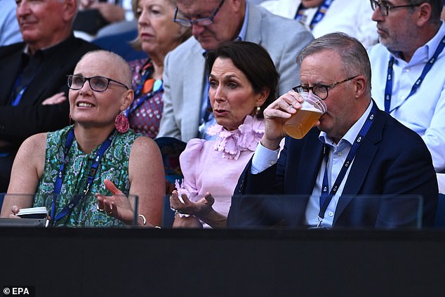 Mr. Albanese enjoys a beer with Ms. Hrdlicka (centre) at the Australian Open on Friday night for the men's semi-final.