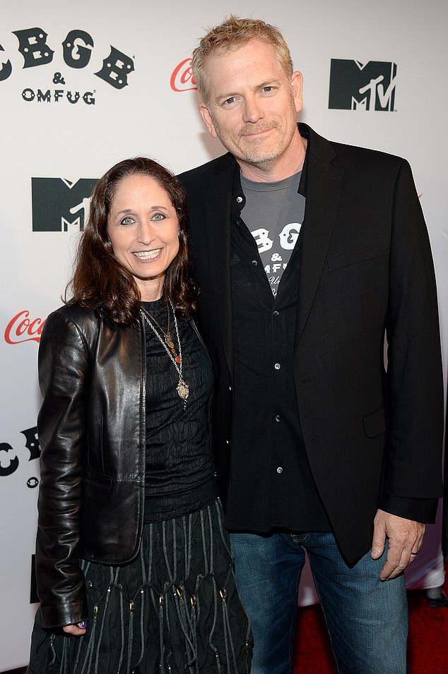 Miller, pictured with his wife, producer Jody Savin, in October 2013, was sentenced in 2015 to one year in prison followed by 10 years of probation.