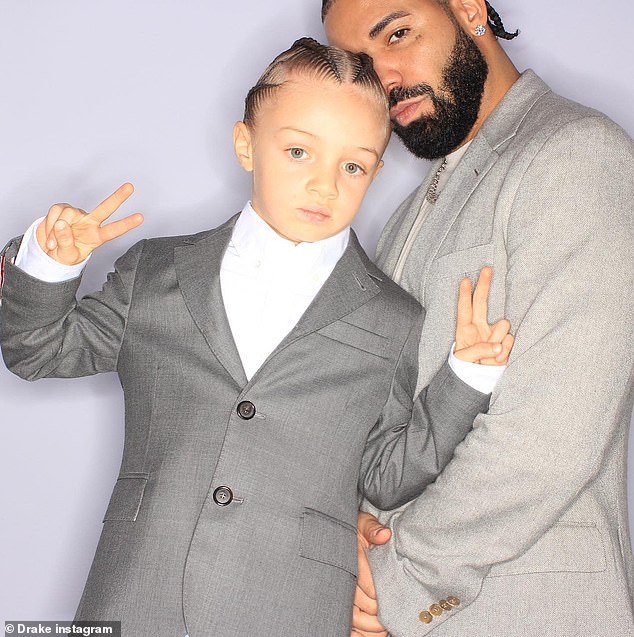 Well-dressed man: In one of the snaps, Drake and Adonis posed for a photo in what appeared to be a photo booth, and the Grammy-winning artist was seen wearing a light gray suit, white shirt, and various items of jewelry