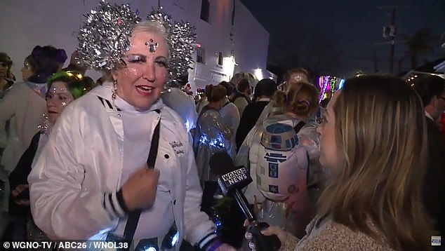 A woman dressed as a glittering Princess Leia