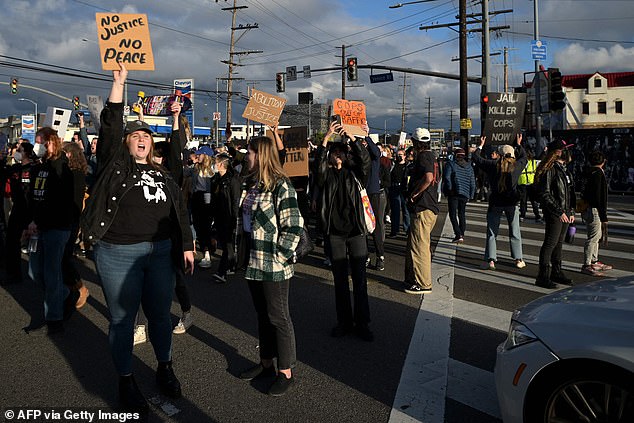 Protesters block traffic as they demonstrate against the fatal police assault on Tire Nichols, in Venice, California on January 29, 2023.