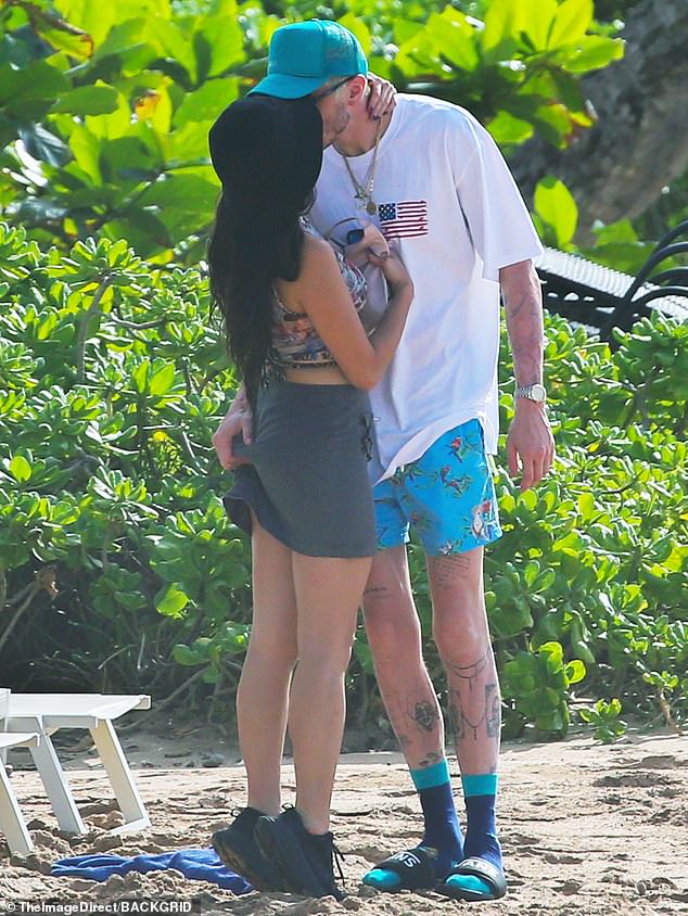 Kissing: The actors spent much of their vacation exploring the island and stopping to kiss.