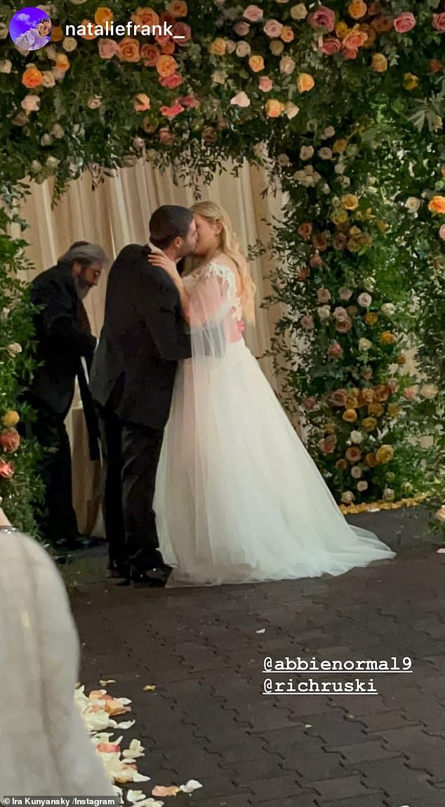 First kiss: Meanwhile, her new husband shared a photo from the wedding ceremony on his Instagram, showing the couple kissing
