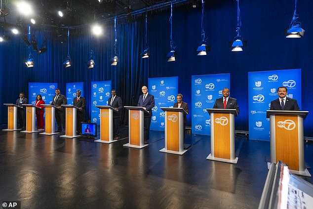 Lightfoot (pictured third from right) faces a packed primary field.  He must win an outright majority, or at least finish in the top two to force a runoff in April.