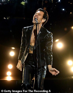 Leather moment: The superstar wore an all-leather outfit with no shirt under his jacket