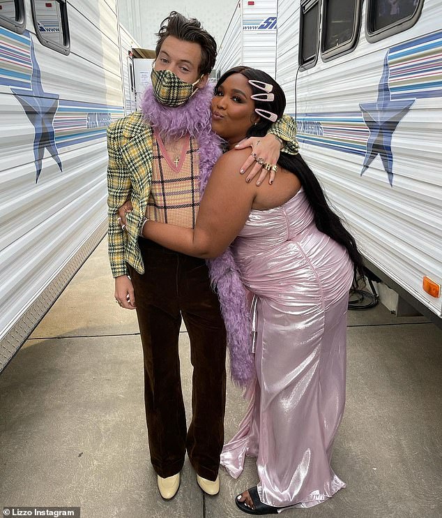 Best friends: Harry and Lizzo stopped for a quick photo at the 2021 Grammys. The pair had previously performed together at her concert in 2020, as well as his headlining show at Coachella in 2022.