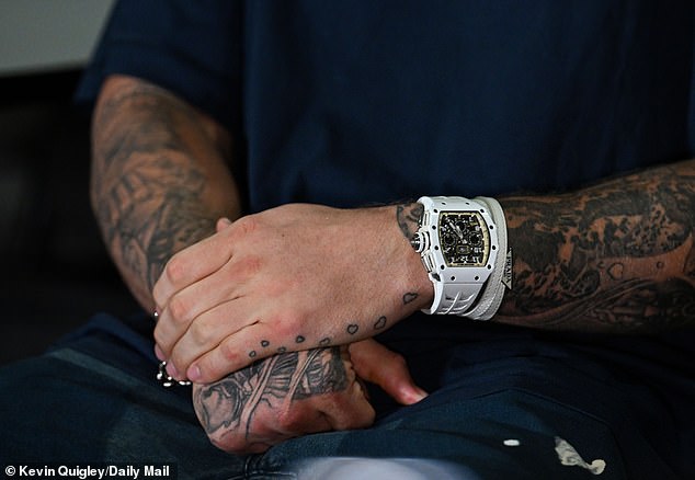 Paul wears a white watch, said to be worth $500,000, for his Sportsmail interview