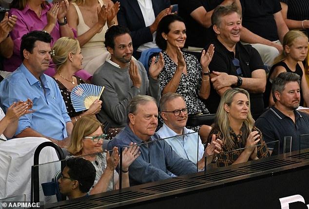 Prime Minister Anthony Albanese (pictured center right) shows his appreciation for the game flanked by former treasurer Peter Costello (left) and his partner Jodie Haydon (right)