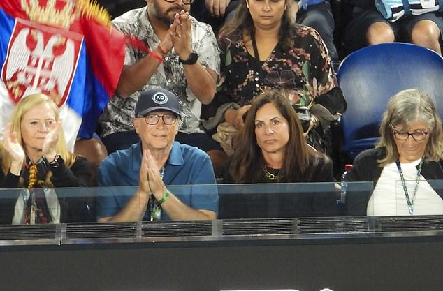 Microsoft founder Bill Gates (pictured center left) watches spellbound at the Open