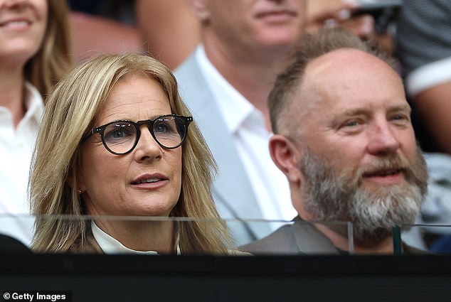 Rachel Griffiths (pictured left) was also in the stands on Sunday night along with her husband Andy Taylor.
