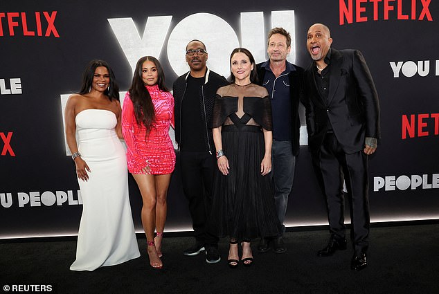 Group photo: Eddie at the premiere teamed up for a group photo with co-stars Nia Long, Lauren London, Julia Louis-Dreyfus and David Duchovny along with director Kenya Barris.