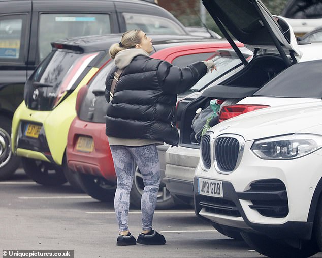 Ready to go: After her big store, Dani got back in her car and loaded it up with her groceries before heading home.