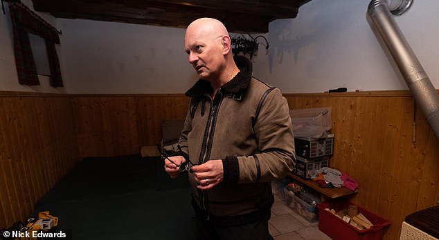 Boxes of toys were arranged neatly along the walls and downstairs in the basement, dozens of dust-covered wine bottles were stacked in corners, as were plastic crates containing canned food, diapers, and medical supplies.