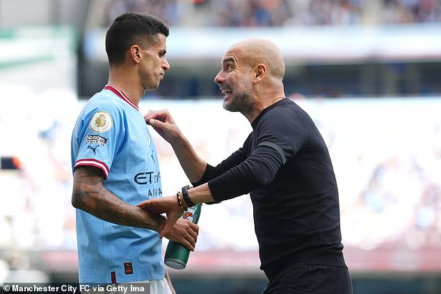 The Portuguese international has fallen out of favor with Pep Guardiola (right) this season