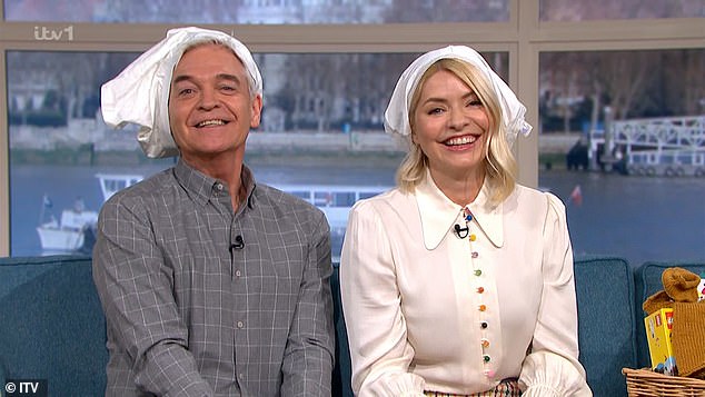 Looking Good: The viral challenge has contestants wearing a pair of pants over their heads, with Holly and Phillip happy to take part and pose for the show