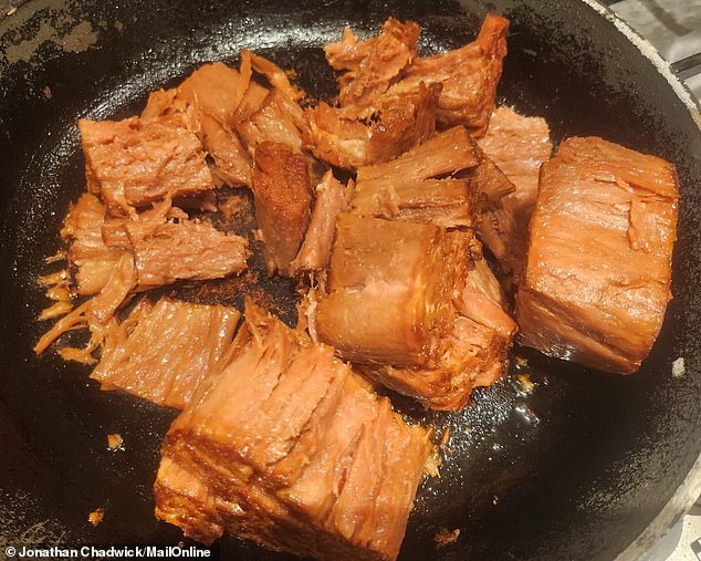 Things start to fall apart: Despite a good amount of hot oil lining my pan, the slices of loin get stuck