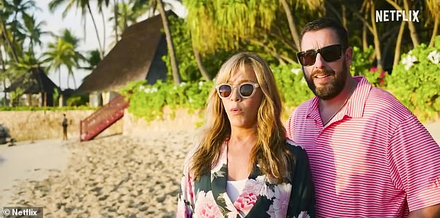 Before the madness begins: Aniston and Sandler wear sunglasses on the tropical island