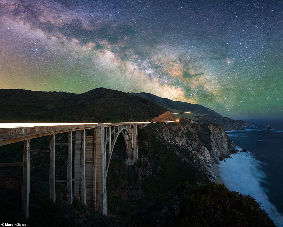 The Milky Way over Bixby Creek Bridge on California's Big Sur coast is beautifully captured in this shot by Zajac. He says: 'This stretch of the California coast features steep cliffs, hidden beach coves, and one of the most spectacular drives one can take anywhere in the world... there is no light pollution here which makes this a perfect destination for stargazing'