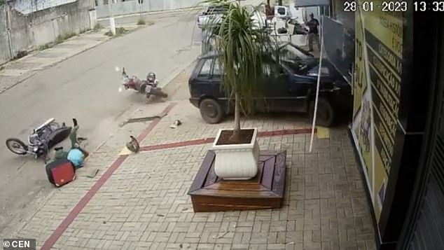 With the motorcycle and its owner already on the turf, the car continued into the plant and the girl, smashing them through the window of the office