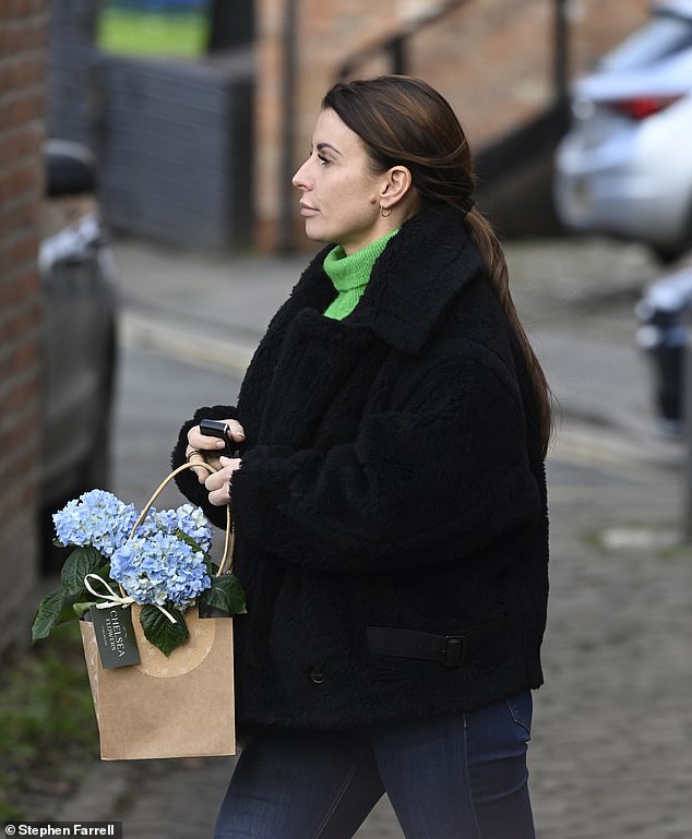 Pretty: The beauty was spotted with a small bag of blue hydrangeas from Chelsea Flowers Wilmslow