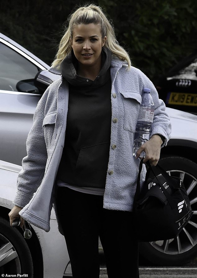 Outfit: The 38-year-old actress opted for a comfortable outfit, wearing a baggy dark gray hoodie under a pale blue jacket.