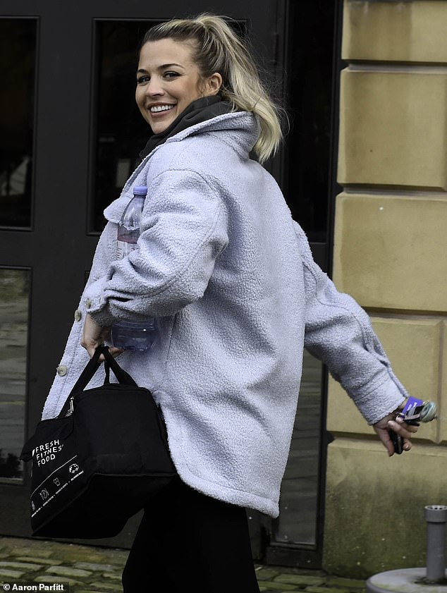 Radiant: Gemma wore her blonde locks in a messy ponytail and opted for a bronzed makeup look while stepping out