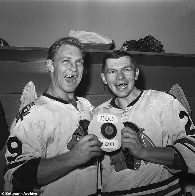 Hull (left) and Stan Mikita (right) flash their famous smiles after a 6-2 win in New York