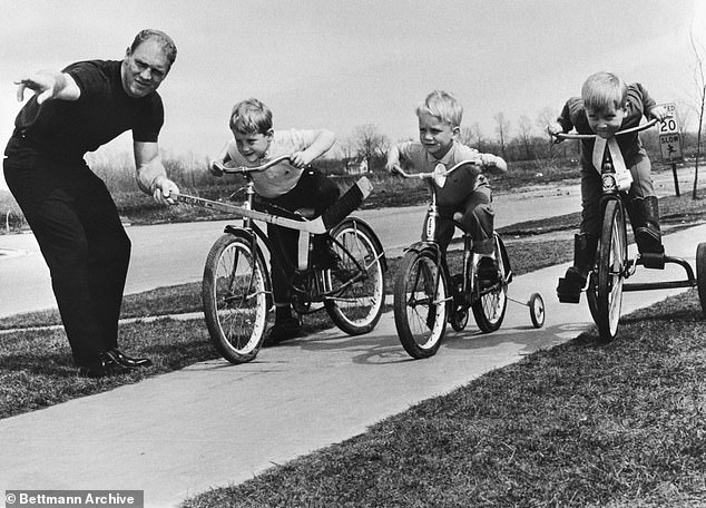 With nothing to do but wait for the Stanley Cup playoffs, hockey's top scorer Bobby Hull of the Chicago Black Hawks spends a little time with his kids at his home in nearby Addison.  Acting as the starter for the race between (lr) Bobby, 5 1/2, Blake, 4 1/2 and Brett, 2 1/2.  Hull have been sidelined until the start of the playoffs with a knee injury.