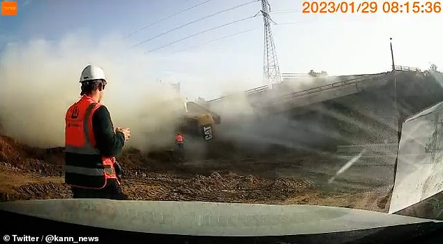 One CAT machine working from the left side of the bridge was plunged into the middle of the collapse