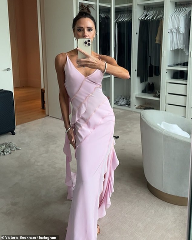 Wow!  The 48-year-old former Spice Girl showed off her incredible figure in a chic pink dress as she held the hand of her 11-year-old daughter in the mirror selfie.