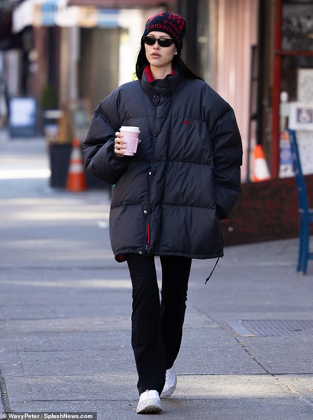 She's Got Legs: While the oversized coat hit her model figure, her long, slender legs were visible in skinny black pants