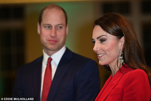 Prince William (pictured, left) appeared to be smiling at his wife as the couple attended the launch event in central London tonight.