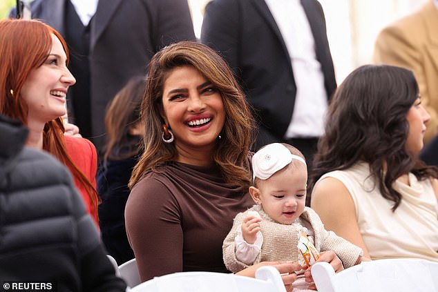 Hello world, This is the first time lovebirds have allowed their baby's face to be seen in a public outing, following their premature birth and 100 days in the NICU.