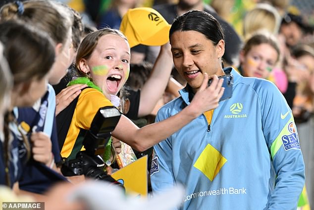The change means Matildas' record crowd of 36,109 is sure to be broken (Sam Kerr pictured with a fan after the game against Thailand last November)