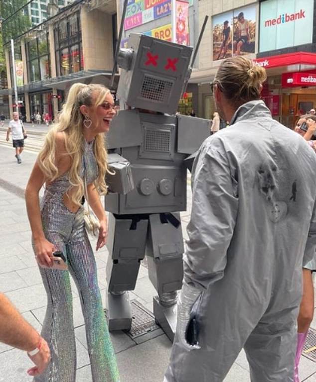 The couple shared a giggle with the robot-clad man on Sydney's busy George St when they arrived for the party.