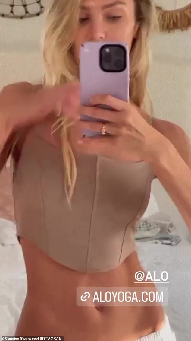 Toned physique: The supermodel donned a sculpted taupe Alo top that showed off her toned midriff, which is priced at $64, according to the fitness brand's official website.