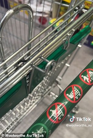 Liam revealed that the easy-to-lose hook under the handlebars on the rear of the trolley (pictured) is designed to store his hat or green reusable bags from Woolworths (right).