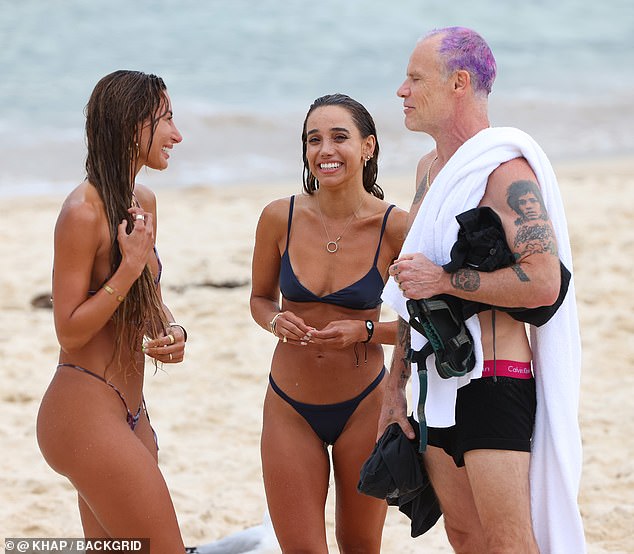 Flea didn't let her underwear get in the way of chatting with the lovely ladies.