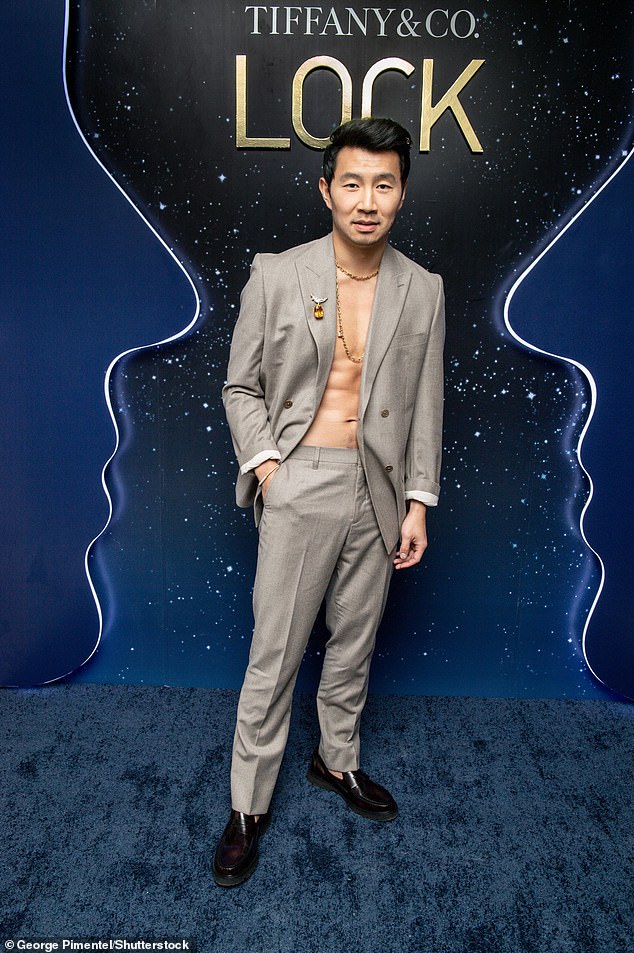 Blazer: Appearing to support Tiffany & Co.'s dazzling LOCK collection, Simu went shirtless under a gray blazer with matching pants.