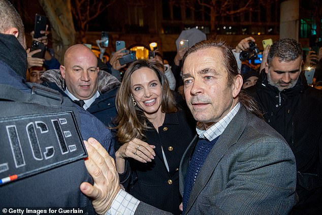 Crazy: The actress, 47, was mobbed by fans while in the French capital, but still had time to sign them autographs