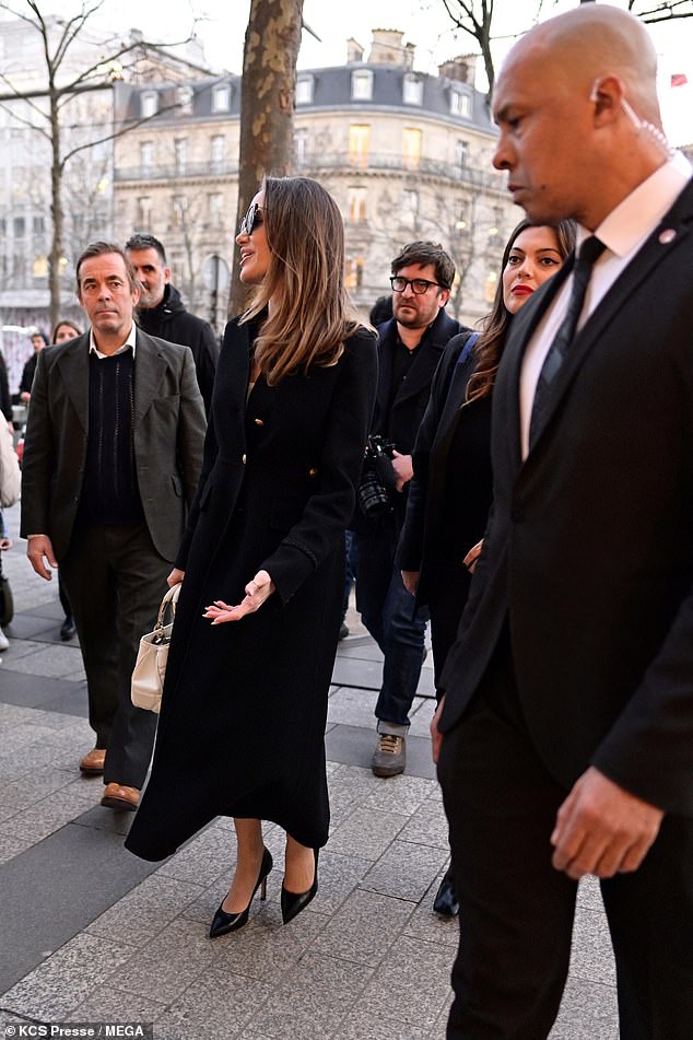 Having fun: Angelina chatted with fans outside the famous Champs-Elysees tourist attraction