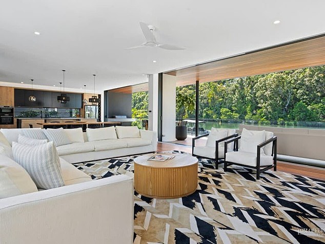 Built directly on the water, the 7,000-square-foot property boasts its own beach, pool, and private jetty Pictured: The incredible living room