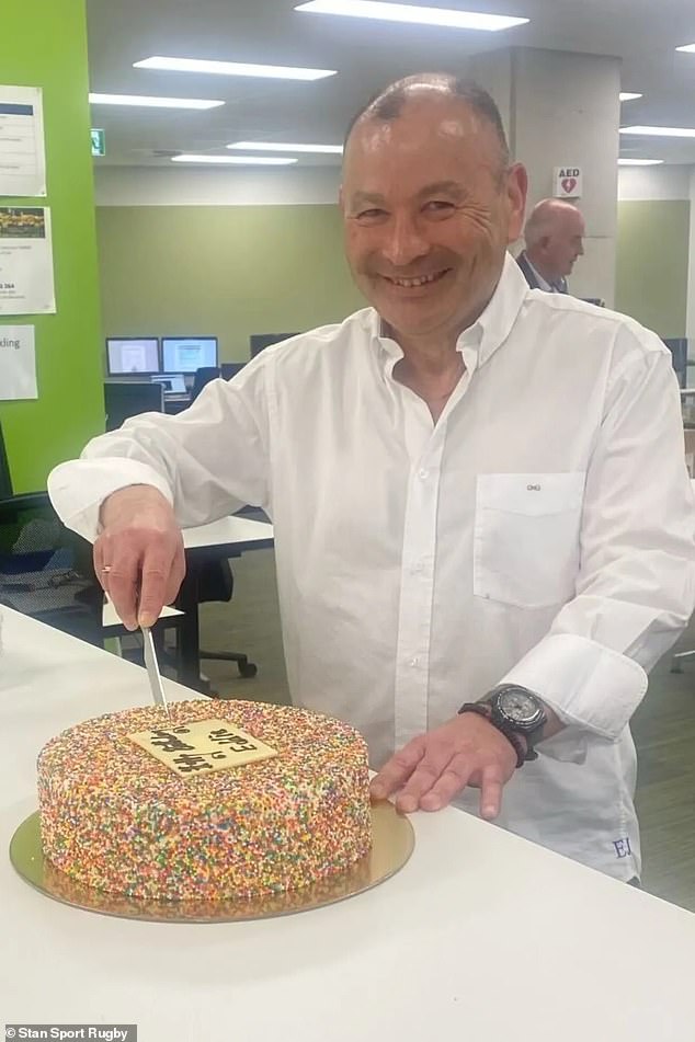 Jones and the custom sprinkle-covered cake presented to him on his 63rd birthday, which was also his first day in charge as Wallabies coach again.