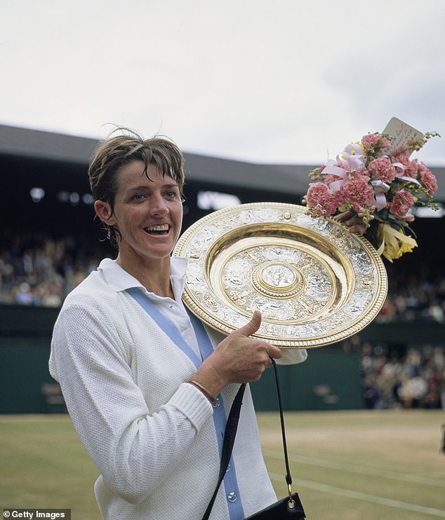 Margaret Court of Australia holds up the Venus Rosewater Dish after defeating Billie Jean King of the United States at Wimbledon in 1970