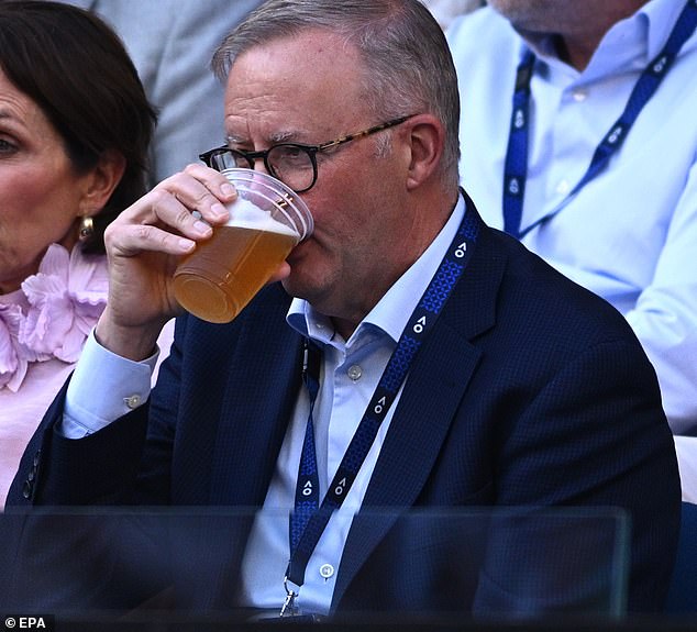 Mr. Albanese (pictured left) enjoys a beer at the Australian Open on Friday night for the men's semi-final on Friday.